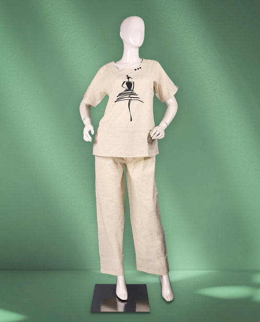Beige colour women's nightwear set featuring a graphic printed top with a round neckline and short sleeves, paired with matching straight-leg pants for a relaxed fit.