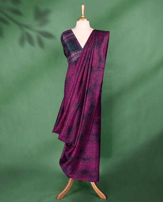 Deep magenta colour Manipuri saree features an abstract black textured pattern throughout the body, creating a bold contemporary statement, without border, and comes with a matching blouse.