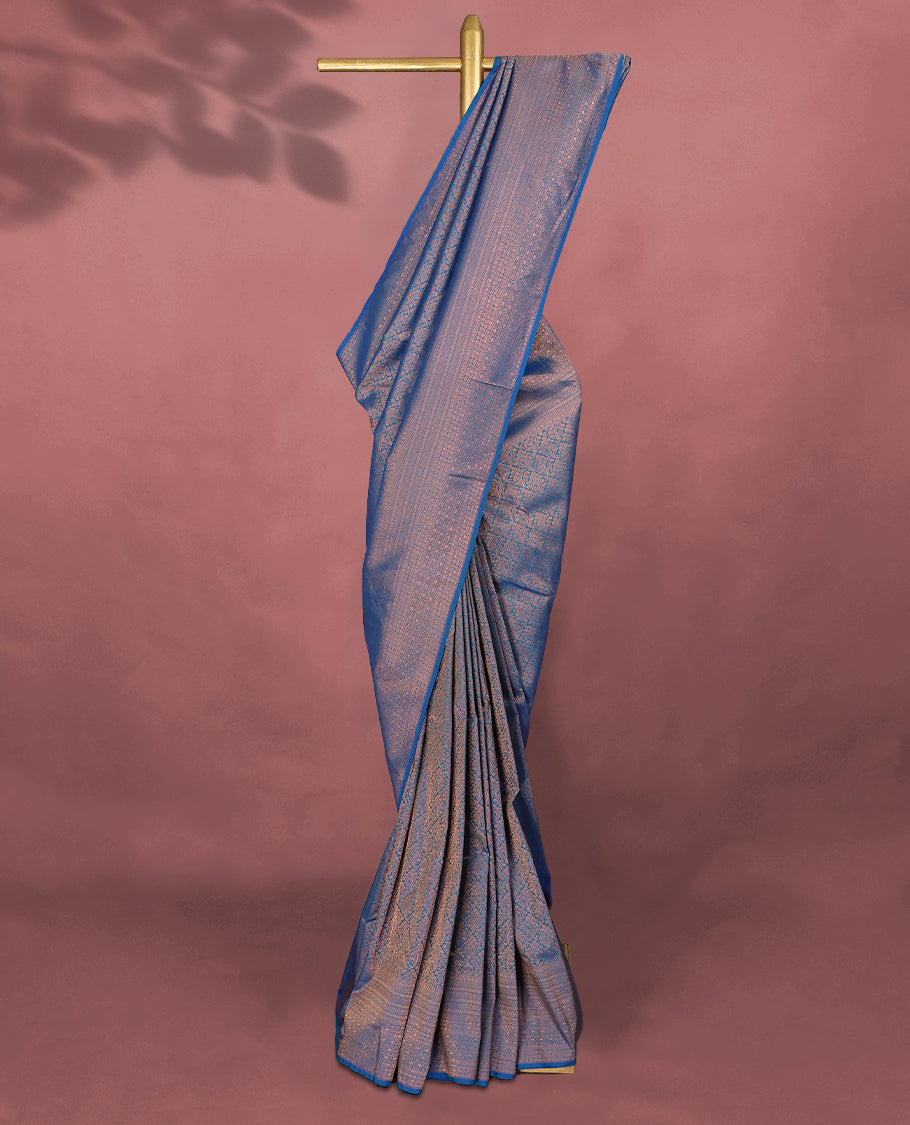 Blue colour Kancheepuram saree featuring an antique zari brocade body, complemented by a traditional border and a matching blouse.