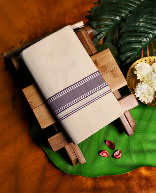 Traditional off white colour cotton dhoti highlighted with a onion pink woven border and fine stripes, offering a perfect balance of comfort and elegance for rituals, temple visits, and festive wear.