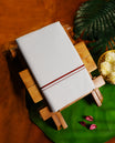 White colour cotton dhoti with a minimal maroon border, Soft, breathable, and ideal for everyday traditional wear or spiritual occasions & A subtle and elegant staple for your ethnic wardrobe.