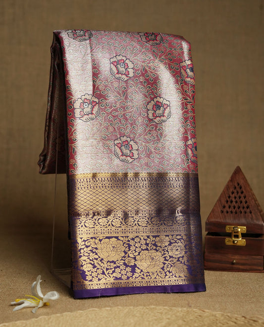 Pink colour and Antique gold Zari Tissue Brocade Saree features intricate a floral Motifs on body and rich violet colour with traditional border & pallu, paired with matching blouse