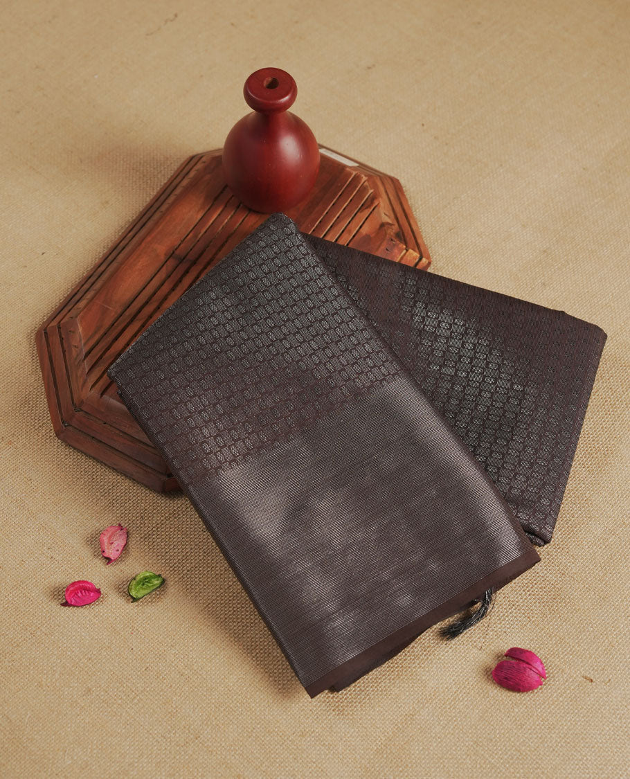 Chocolate colour semi silk saree featuring neem zari Brocade Pattern all over the body, complemented by a Self Colour woven border with detailing, Pallu & blouse.