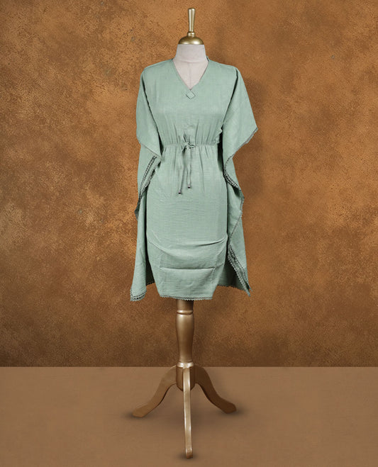Sage green kaftan-style nightwear dress with V-neckline, drawstring waist tie, relaxed draped sleeves, and lace-detailed edges.