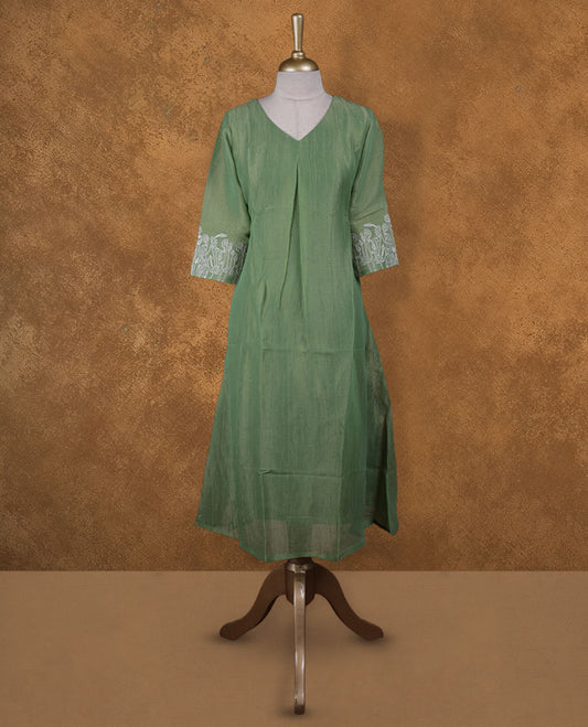 Pastel green and gold double shade colour kurti with white floral thread pattern on sleeve, knee length design, styled with a Round neckline.