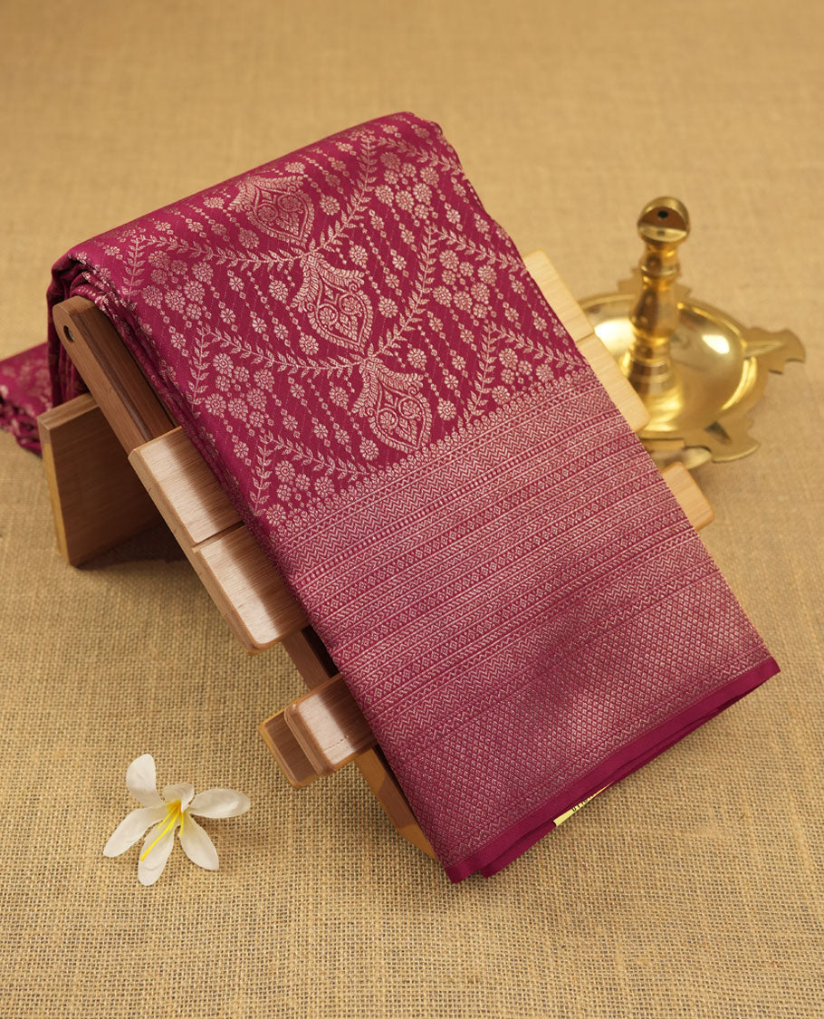 Dark Maroon colour Kanchipuram pattern Manthrakodi saree featuring geometric antique zari jacquard pattern, self turning border and zari jaquard blouse piece.