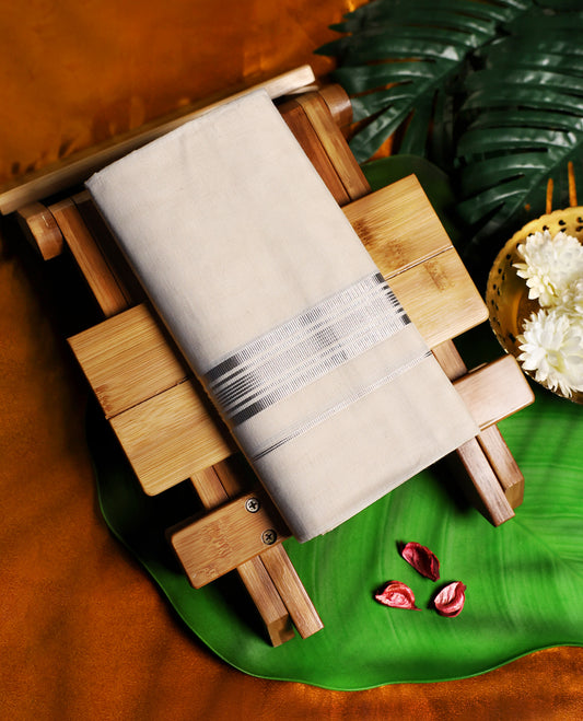 Classic off white colour cotton dhoti adorned with a sleek silver zari border featuring subtle striped detailing, combining comfort and elegance, perfect for traditional functions and festive wear.