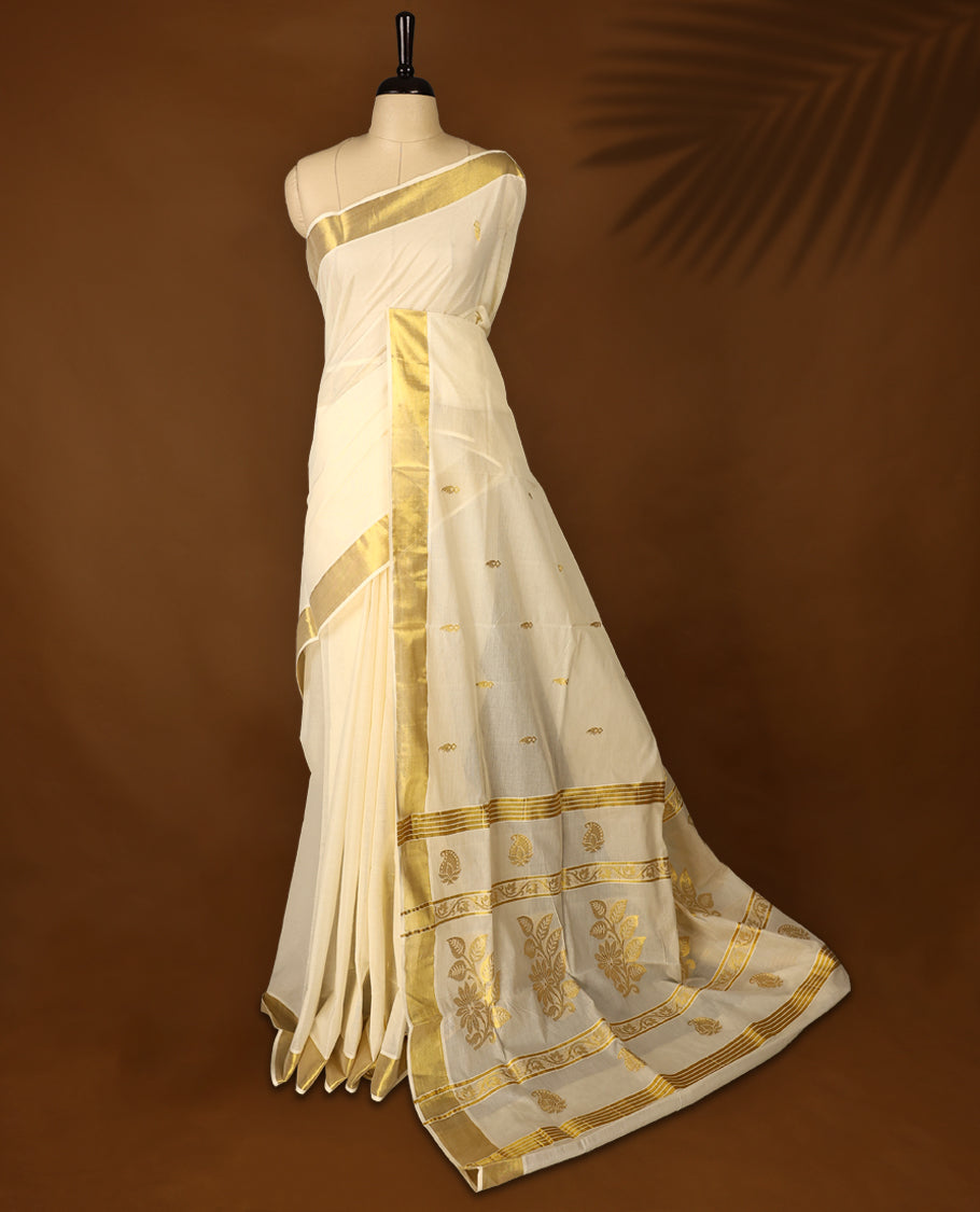 Elegant off white cotton Kerala saree with a plain body, gold zari fancy kasavu border, rich woven pallu, and matching blouse. Perfect for festive occasions and traditional celebrations.