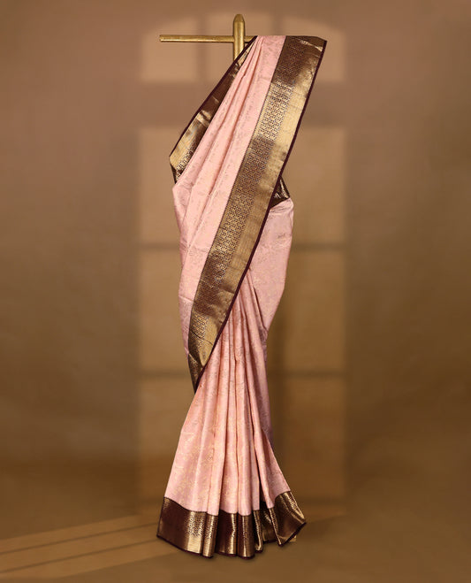 Soft blush Colour traditional Kancheepuram silk saree adorned with antique zari floral kodi motifs on the body, featuring a dark maroon border with rich, heavy golden zari floral Kodi patterns, and paired with a matching blouse.