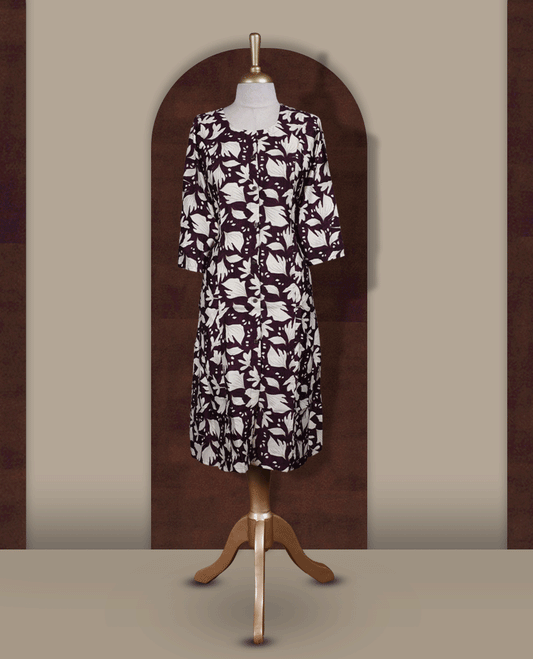 Wine colour kurthi featuring bold off white colour floral prints, a round neckline with front button detailing, and comfortable 3/4th sleeves & Designed in a flattering A line silhouette, perfect for casual outings and everyday elegance.