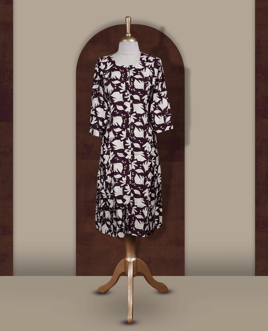 Wine colour kurthi featuring bold off white colour floral prints, a round neckline with front button detailing, and comfortable 3/4th sleeves & Designed in a flattering A line silhouette, perfect for casual outings and everyday elegance.