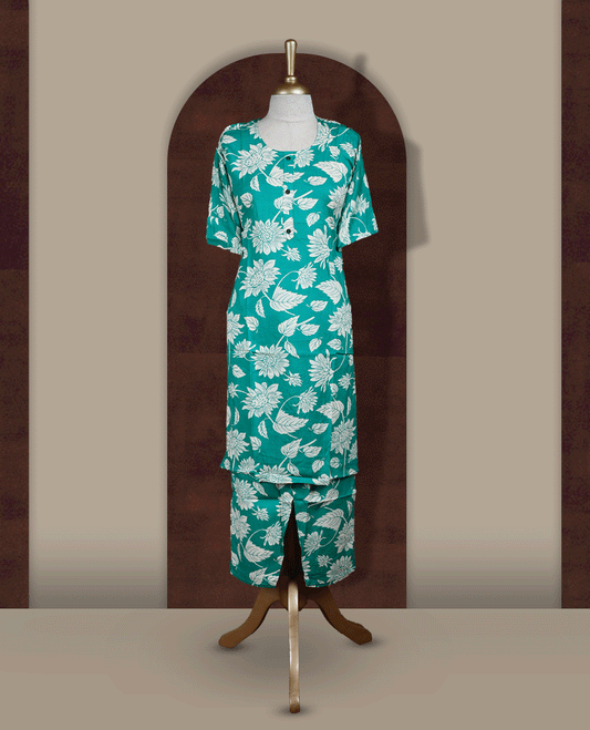 Turquoise blue colour coord set featuring a round neck with short sleeves, adorned with white floral prints