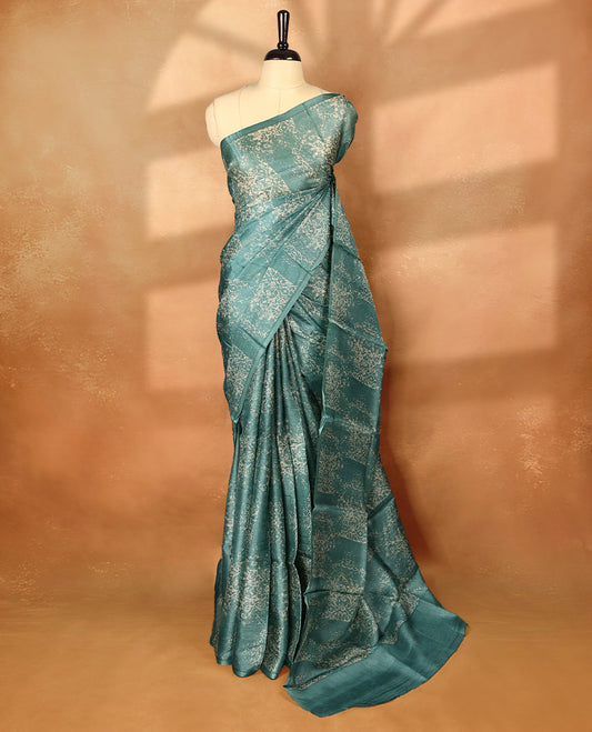 Pastel blue colour pure tussar silk light weight saree with full body abstract floral print, no defined border and pallu, paired with matching abstract printed blouse.