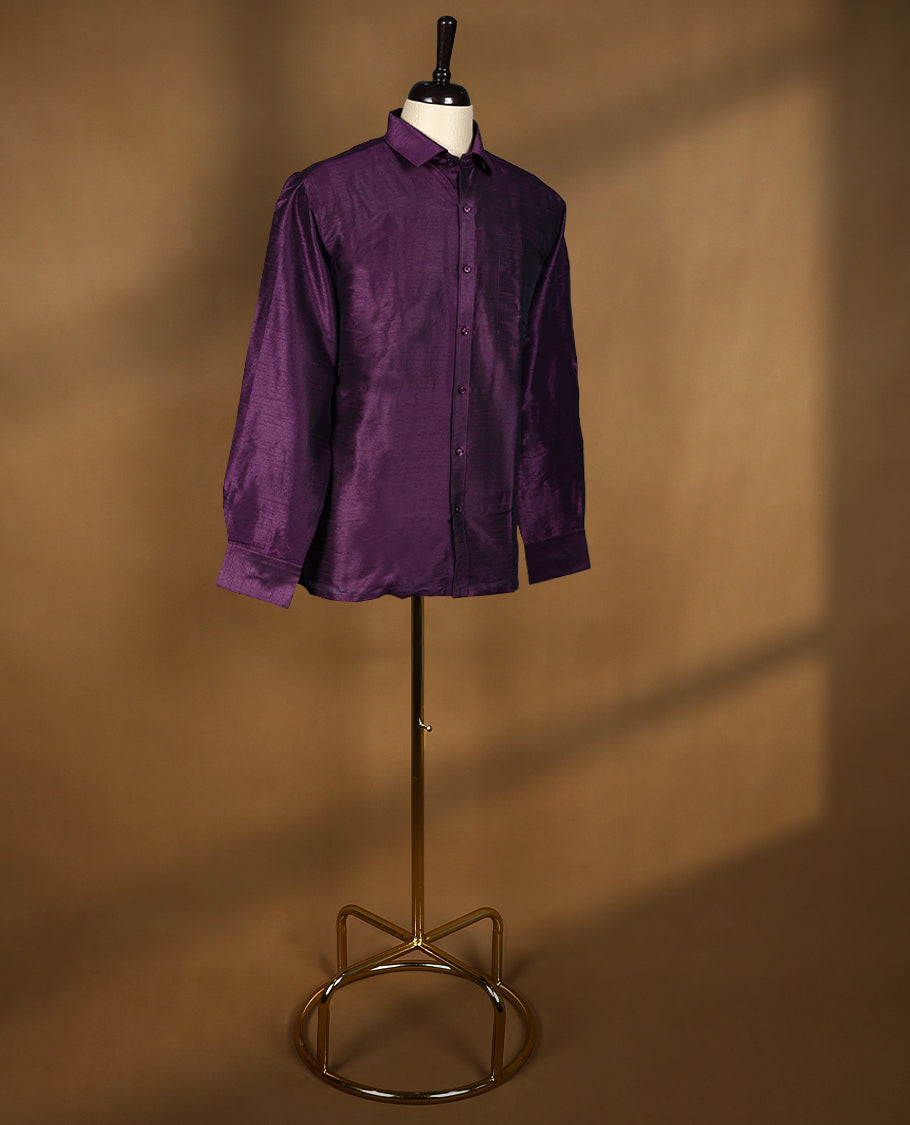 Rich wine purple colour men’s shirt in a relaxed formal fit, crafted with a glossy self textured finish, full sleeves, classic collar, and chest pocket ideal for festive or evening wear.