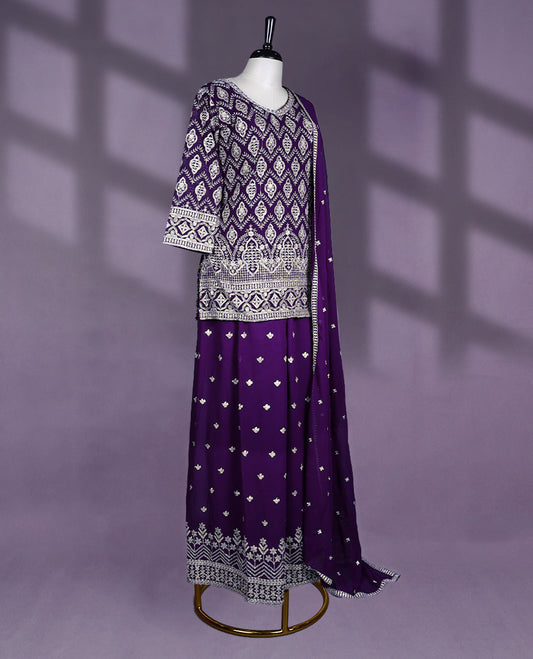 Deep purple Colour sharara set features a V neck and three quarter sleeves, adorned with heavy silver embroidery, Comes with a matching dupatta and an embellished sharara bottom.