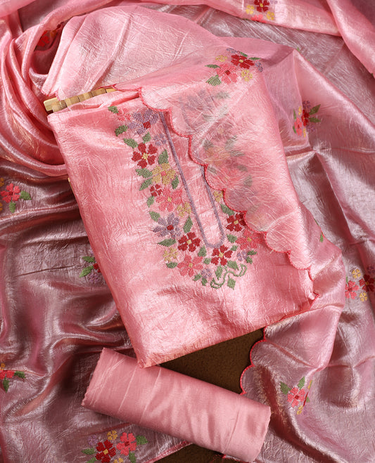 Baby pink colour churidhar material with elegant floral embroidery on the neckline and scalloped edges, paired with a plain matching bottom and a dupatta highlighted with floral motifs.