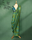 Olive green colour Manipuri saree with subtle blue textured patterns, minimal border, and comes with a matching blouse.