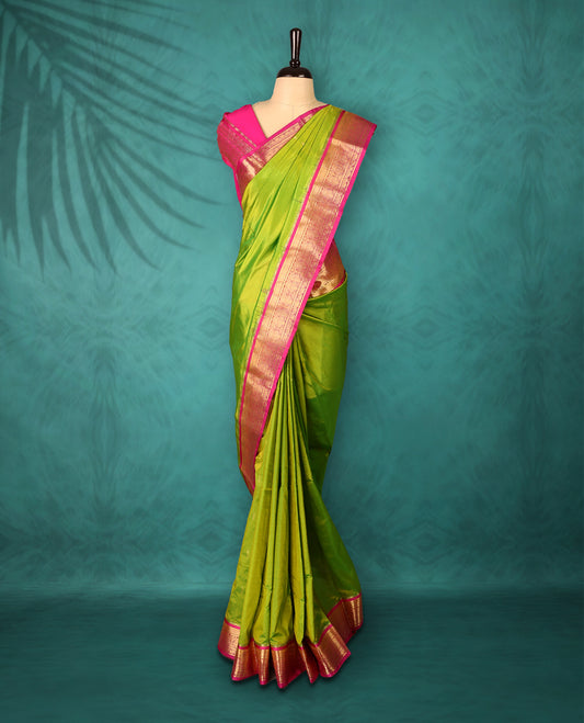 Neon Green colour Traditional Kancheepuram Silk saree with small gold motifs on body, Magenta traditional border with intricate gold zari weaving, grand zari pallu, perfect for Bharatanatyam, with matching blouse.