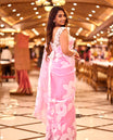 Light baby pink colour pure organza silk saree featuring applique floral work on the body, a delicate thin border, and paired with a matching blouse