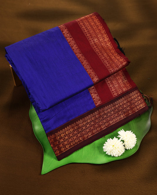 Blue colour mixed Kalyani cotton saree featuring Plain body, paired with a Maroon colour traditional border and pallu, with matching blouse