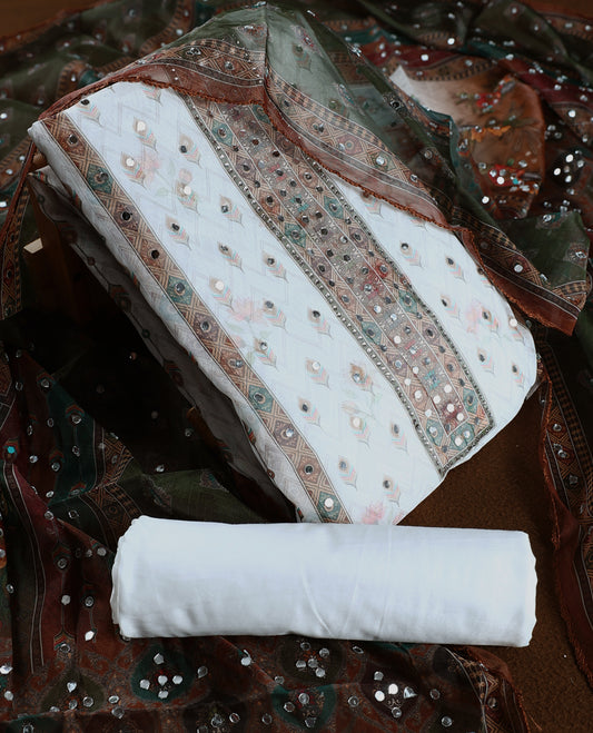 Elegant white churidhar material adorned with mirror work and subtle floral prints, enhanced by a rich green brown printed dupatta with sequin highlights, paired with a plain white bottom for a classy festive look.