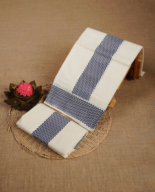 Cream colour cotton set mundu highlighting Navy blue colour zig zag patterned border.
