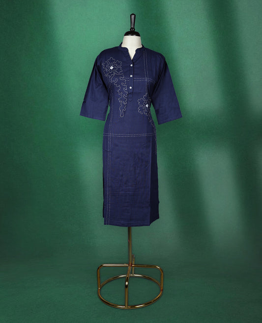 Navy blue colour kurti crafted from soft cotton, featuring a band collar with a buttoned placket, three quarter sleeves, and delicate thread embroidery with floral and dotted patterns for an elegant everyday look.