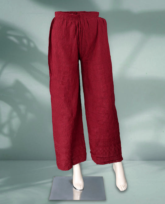 Maroon colour textured palazzo pants featuring an elasticated waistband and intricate woven patterns, offering comfort