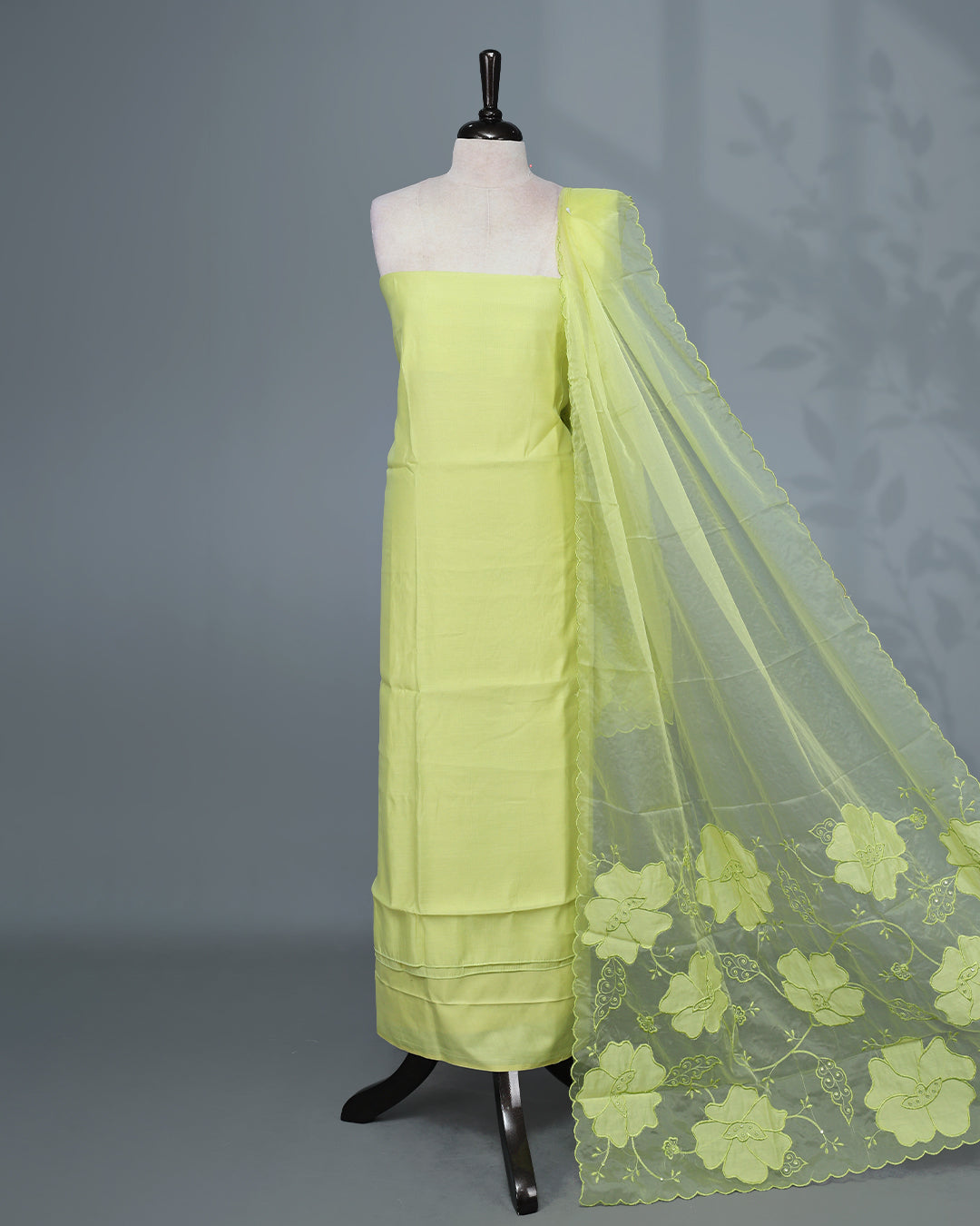 Lemon Yellow Colour Mul Chanderi Salwar Material paired with a matching bottom and a graceful floral embroidered organza dupatta.