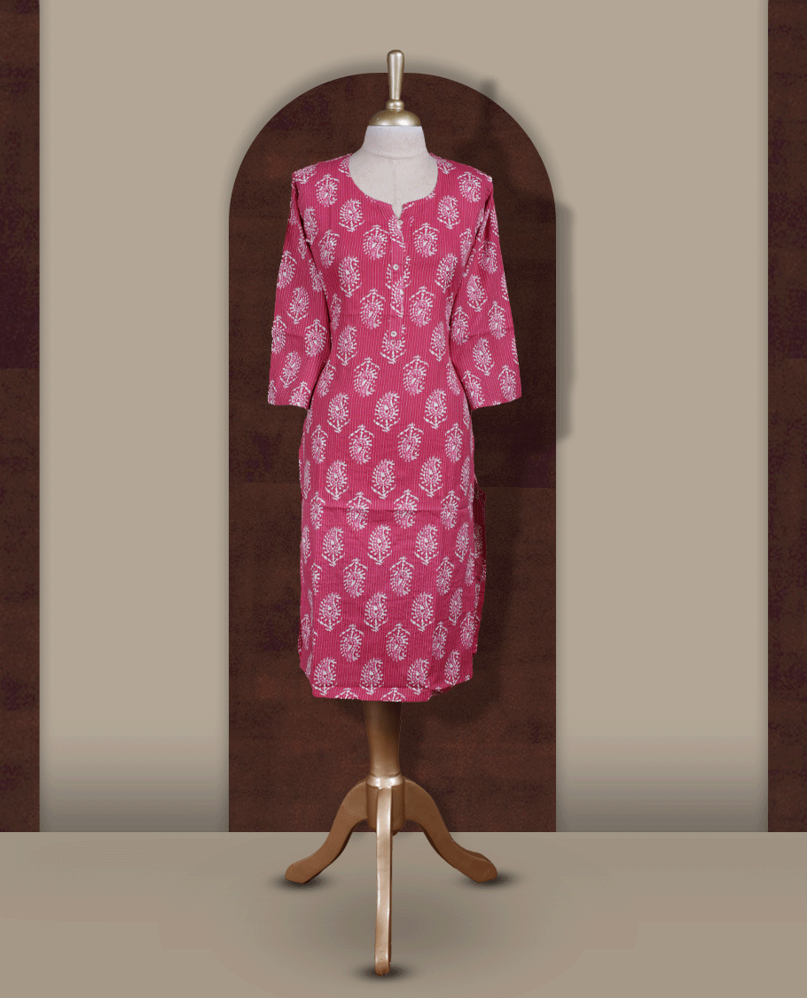 Magenta colour kurthi adorned with delicate white paisley prints, featuring a stylish V notch round neckline and comfy 3/4th sleeves & Designed in a straight cut silhouette for a graceful, everyday look.