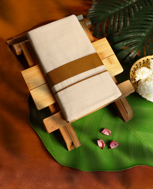 Ivory handloom pure cotton double dhoti featuring a golden brown border with fine detailing, crafted in a traditional yet elegant finish, ideal for festive and cultural occasions.