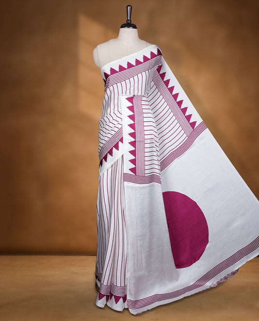 White colour semi modal saree featuring wine berry colour geometric borders and fine stripe detailing, finished with an oversized circular motif on the pallu, paired with a matching printed blouse.