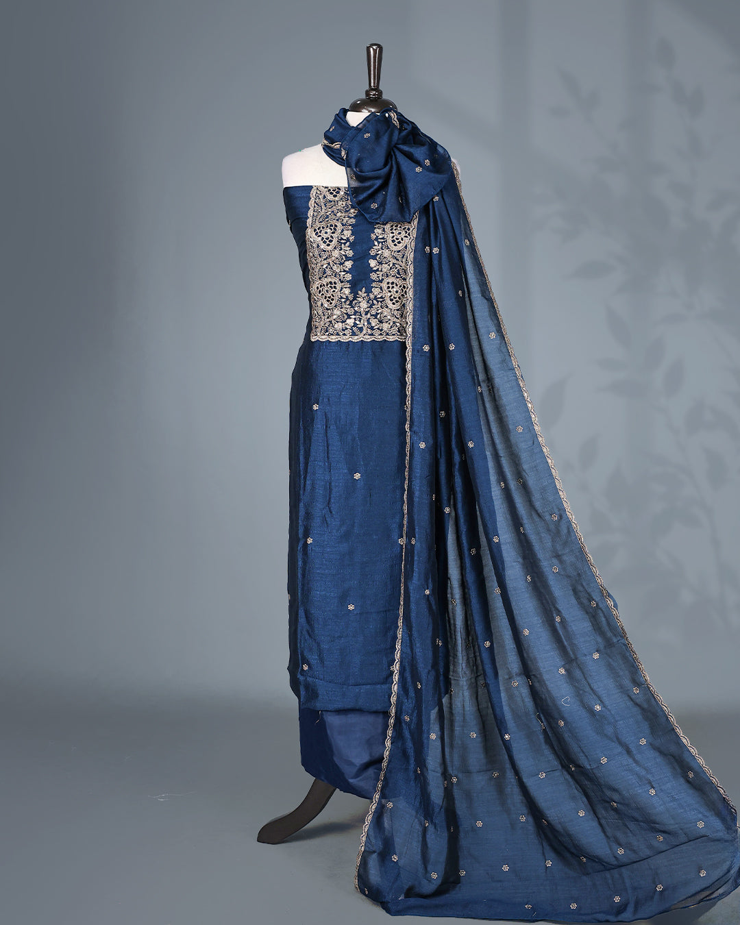 Navy Blue Colour Vijitra Silk Salwar Material Featuring Elegant White Thread Embroidery on the Front Panel, paired with a matching bottom & graceful embroidered Dupatta.