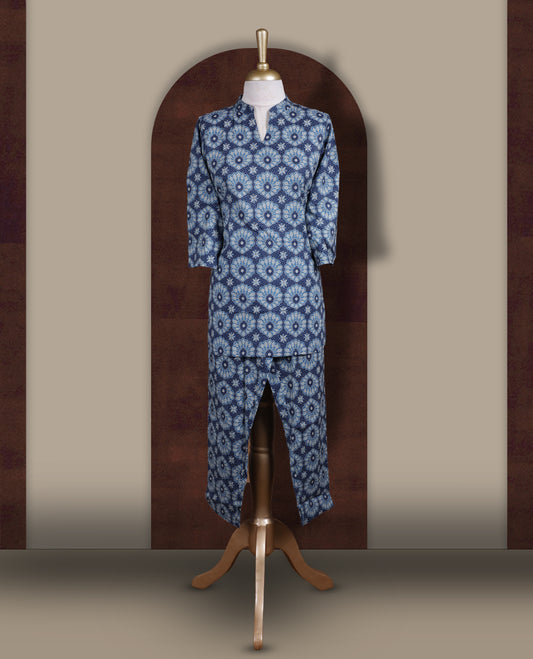 Blue colour cotton coord set with intricate all over prints, featuring a stylish mandarin collar and 3/4 sleeves, Paired with matching straight pants, it offers a perfect blend of comfort, elegance, and everyday sophistication.