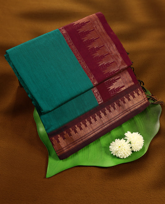 Peacock Green colour mixed Kalyani cotton saree featuring Plain body, paired with Maroon colour traditional border and pallu, with matching blouse