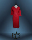 Red colour kurti adorned with an all over small geometric print, styled with a chic notch neckline enhanced by delicate button detailing, and finished with comfortable three quarter sleeves
