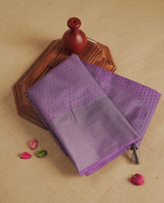 Lavender colour semi silk saree featuring neem zari Brocade Pattern all over the body, complemented by a Self Colour woven border with detailing, Pallu & blouse.