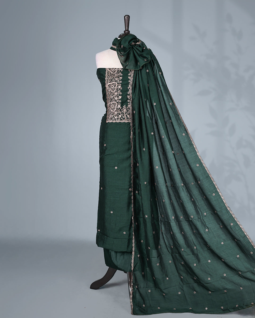 Bottle Green colour  Vijitra Silk Salwar Material featuring elegant white thread embroidery on the front panel, paired with a matching bottom and a gracefully embroidered dupatta.
