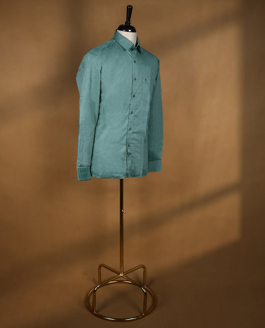 Dusty teal green colour OTTO men’s shirt in a relaxed formal fit featuring a subtle self textured body, classic collar, full sleeves, and front chest pocket ideal for office or smart casual wear.