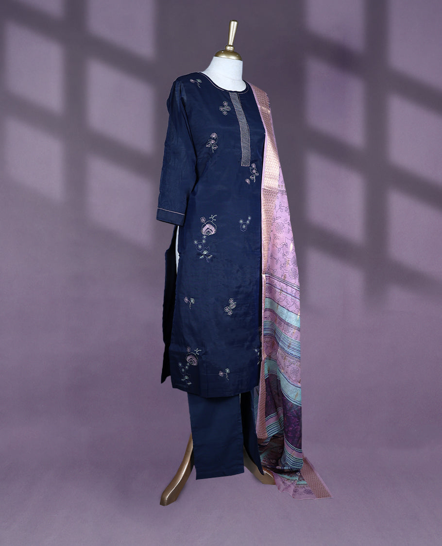 Navy blue Colour kurti set featuring a straight-cut silhouette with 3/4th sleeves, a simple round neckline with a front placket, and delicate floral embroidery, paired with plain Bottam & a richly patterned pastel dupatta with golden detailing.