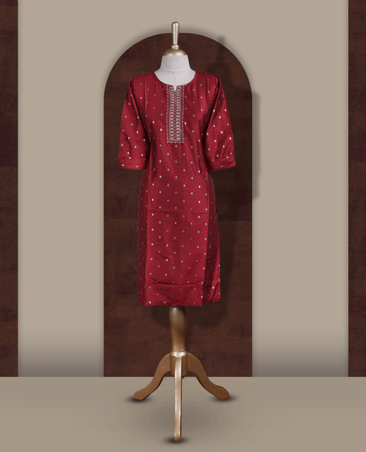 Deep maroon colour kurti from TWARA, adorned with subtle elegant motifs and intricate embroidery on the neckline, finished with a round neck and elbow length sleeves.