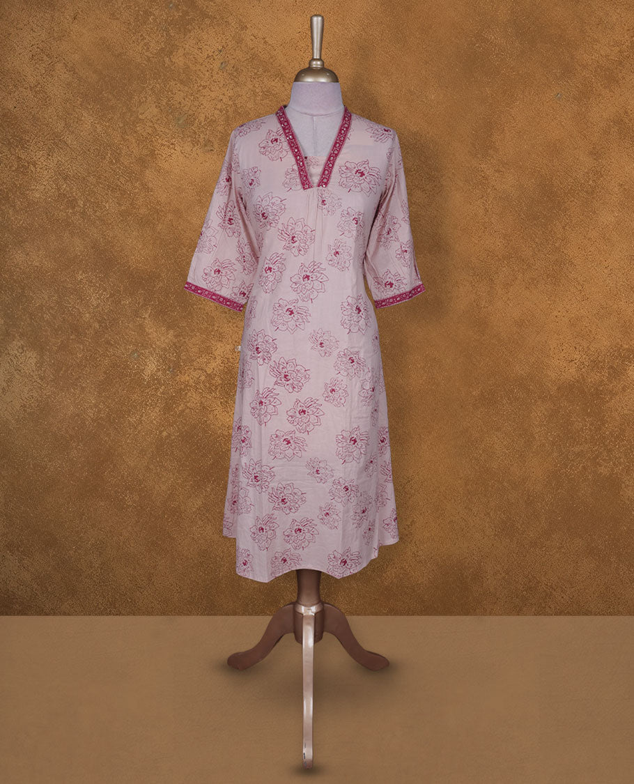 Light pink colour kurti BY VISMAY with floral prints, featuring a straight calf length silhouette, a V notch neckline with printed border, and three quarter sleeves.