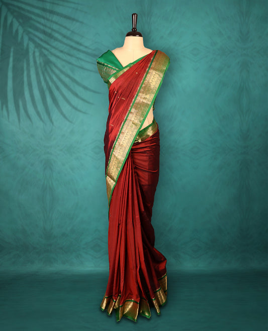 Maroon colour Traditional Kancheepuram Silk saree with small gold motifs on body, Green traditional border with intricate gold zari weaving, grand zari pallu, perfect for Bharatanatyam, with matching blouse.