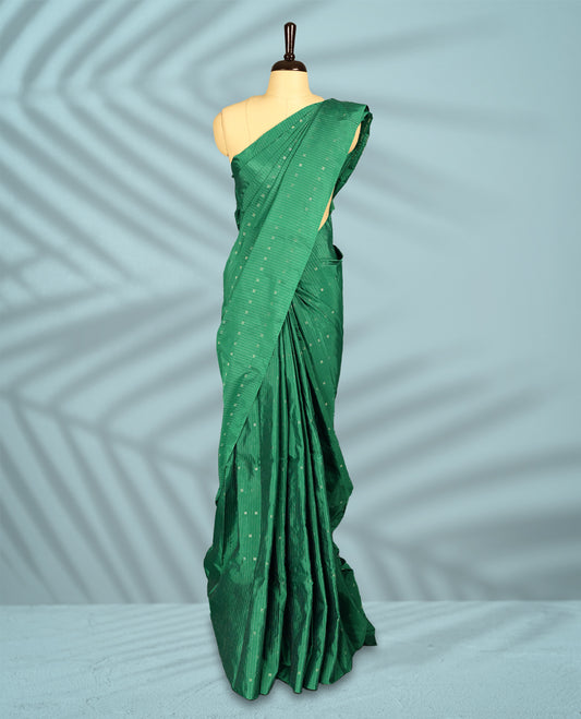 Green Colour semi silk saree showcases delicate square and line motifs all over the body, features a sleek no-border style, and comes with a matching blouse.