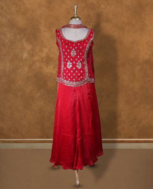 Red colour sharara set adorned with intricate silver embroidery and sequins work & The fitted embellished top pairs beautifully with the flared bottoms and matching dupatta.