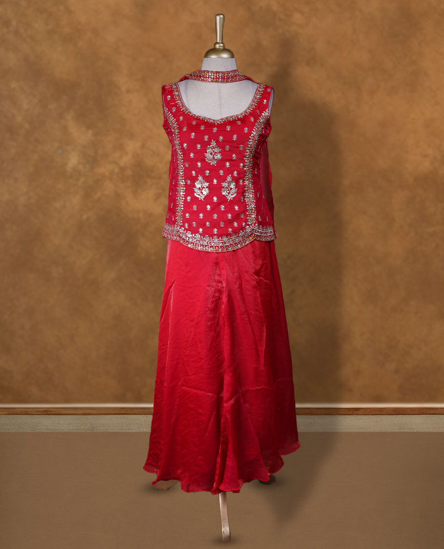 Red colour sharara set adorned with intricate silver embroidery and sequins work & The fitted embellished top pairs beautifully with the flared bottoms and matching dupatta.