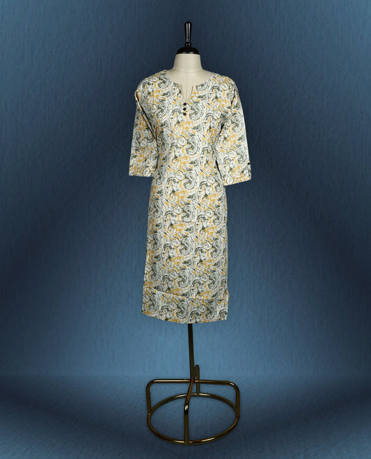 Beige colour kurti with artistic green and mustard swirl print, adorned with wooden buttons along the front placket, featuring a V slit neckline and stylish three quarter sleeves.