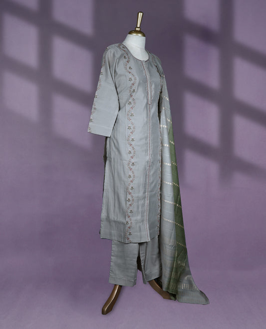 Sophisticated grey colour kurti set features a round neck with a keyhole slit, three-quarter sleeves with subtle embroidery, and is complemented by straight pants and a contrasting green dupatta with delicate golden patterns.