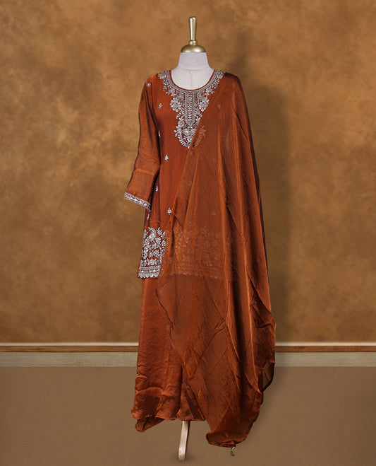 Brown colour sharara set adorned with intricate silver embroidery and sequins work & The fitted embellished top pairs beautifully with the flared bottoms and matching dupatta.