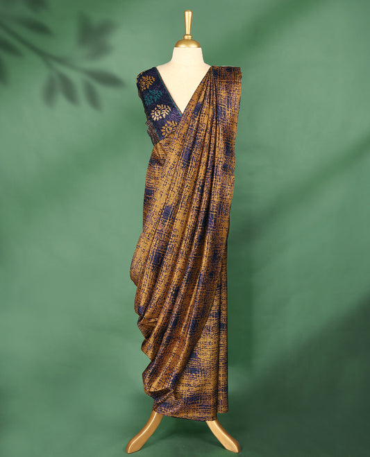 Mustard yellow Colour Manipuri saree features a body with abstract navy colour patterns, a subtle navy border, and comes with a matching blouse.